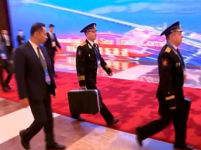 Footage has emerged showing Russian President Vladimir Putin  accompanied by officers with a nuclear briefcase during his trip to China.