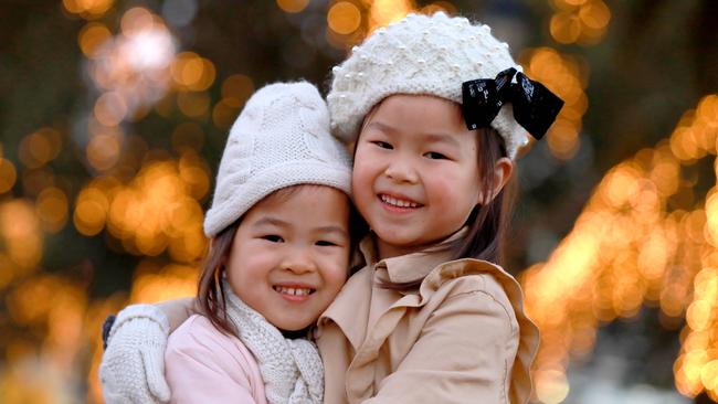 Sisters Estelle and Sienna Yip rugged up ready to enjoy the winter wonderland.