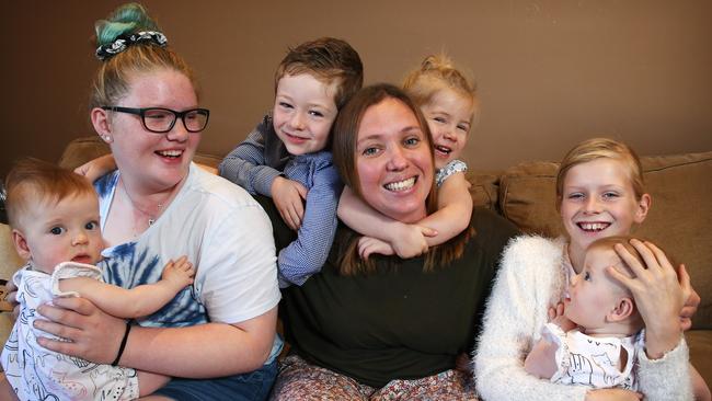 Grace Waller, 14, left and Ella Seebeck, 9, right, helped Ellen pull out of postnatal depression by regularly helping out with her kids. Picture: Toby Zerna