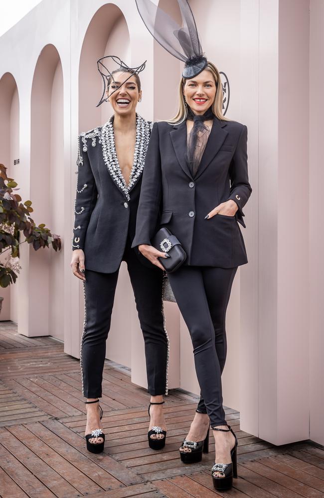 Ashley Hart (left) wearing a Richard Nylon embellished tux and her sister Jess Hart in Mossman.