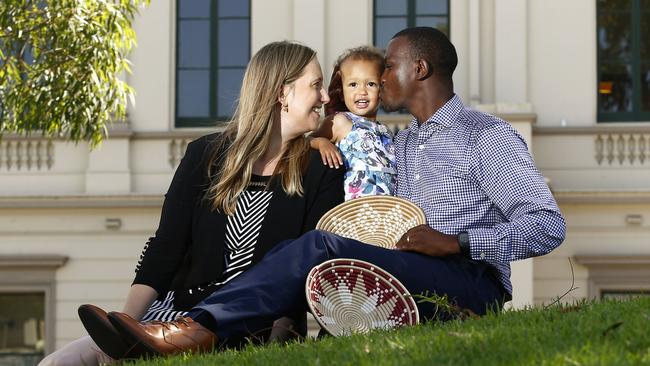 Sabrina and Jean Nepo Sibomana and their daughter Raphaella back home in Paddington. Picture: John Appleyard