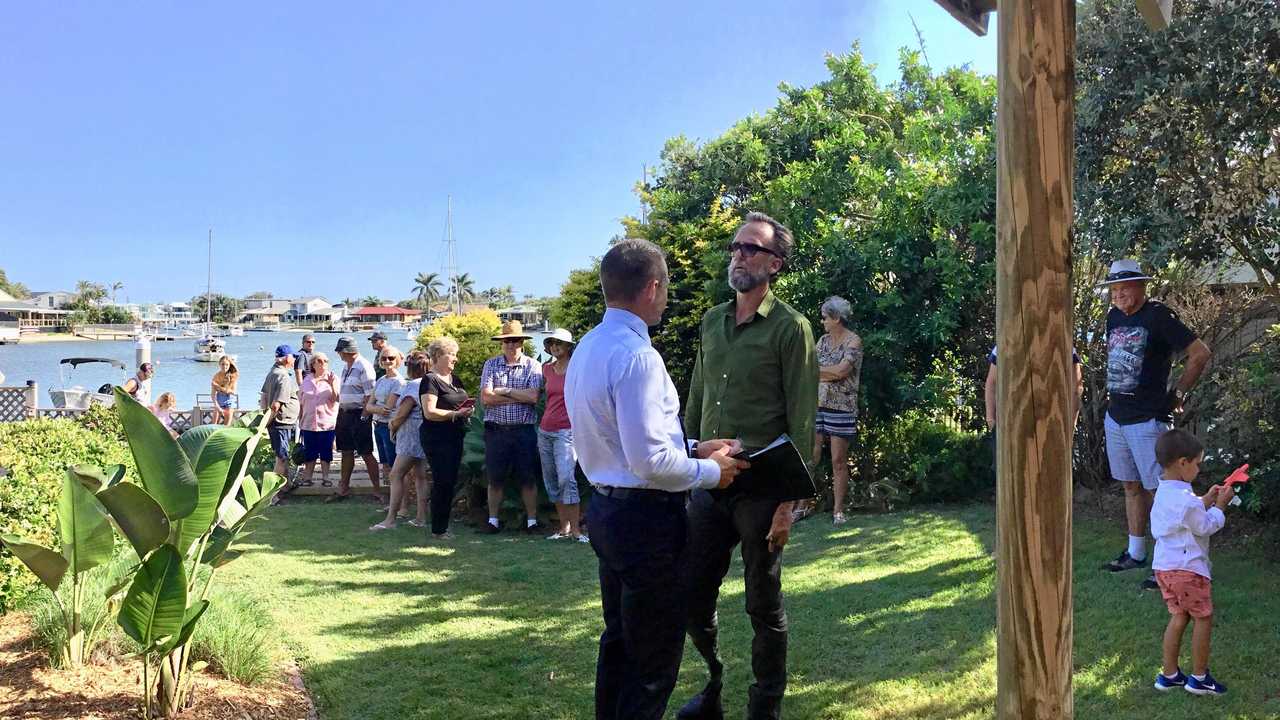 Auctioneer Gordon Macdonald and marketing agent Mark Unkel of Elite Lifestyle Properties in discussion at the auction of 30 Elanora Ave, Mooloolaba, on Saturday. Picture: Erle Levey