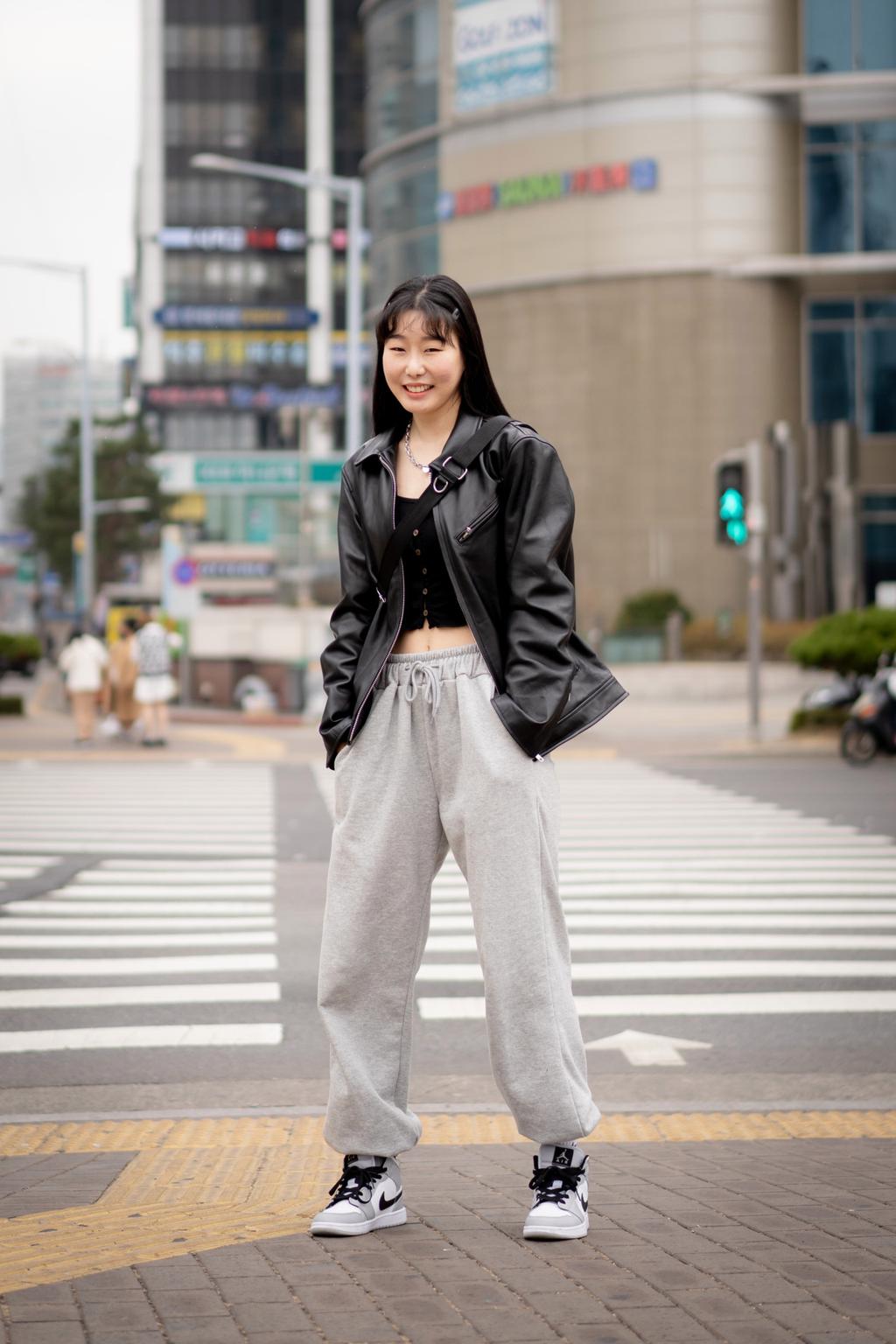 Sydney Sweeney looks casual yet trendy in a grey sweatsuit and Miu Miu  sunglasses while stepping