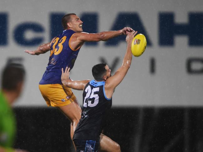 Christopher Atkinson of Buffaloes takes on Matthew Motlop in the ruck. Picture: (A)manda Parkinson