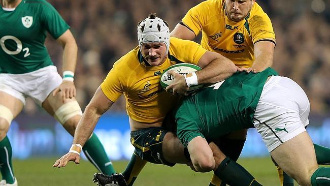 DUBLIN, IRELAND - NOVEMBER 16: Ben Mowen of the Wallabies is tackled by Cian Healy of Ireland during the International match between Ireland and Australia at Aviva Stadium on November 16, 2013 in Dublin, Ireland. (Photo by Ian Walton/Getty Images)