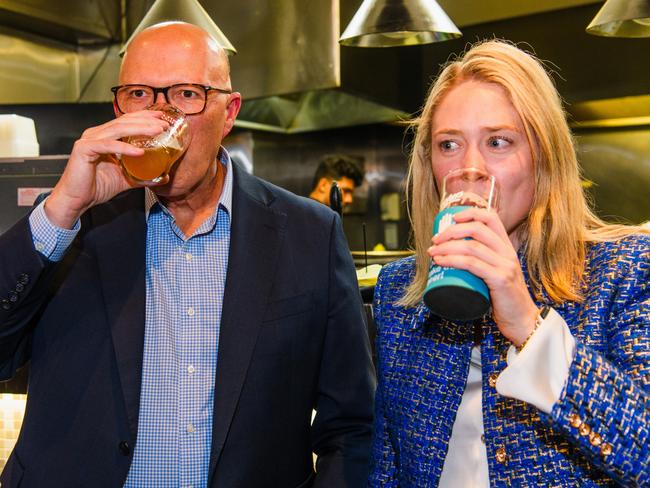 Liberal candidate Amelia Hamer having a beer with Opposition Leader Peter Dutton. Picture: Getty