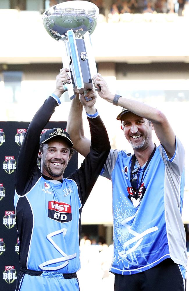 Travis Head and Jason Gillespie with the trophy after the Strikers’ BBL win in February. Picture: Sarah Reed