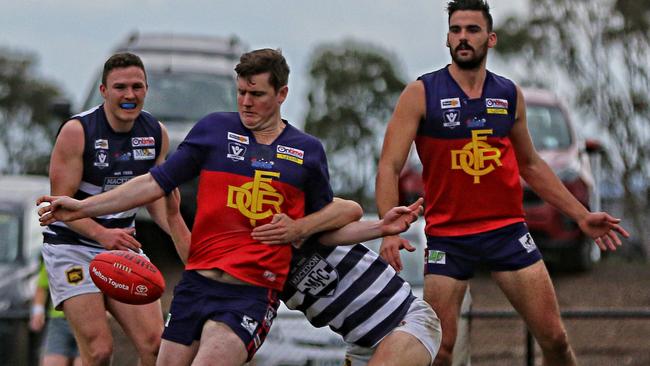 Diggers Rest star Cale Morton gets a kick away. Picture: Aaron Cook