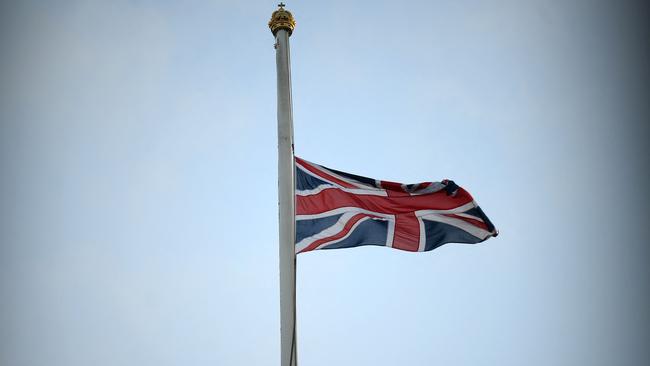 A union flag flies at half mast atop Buckingham Palace in central London after it was announced that Queen Elizabeth II has died.