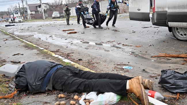 Among those murdered as they went about their lives was a man who had been shopping for potatoes. Picture: AFP.