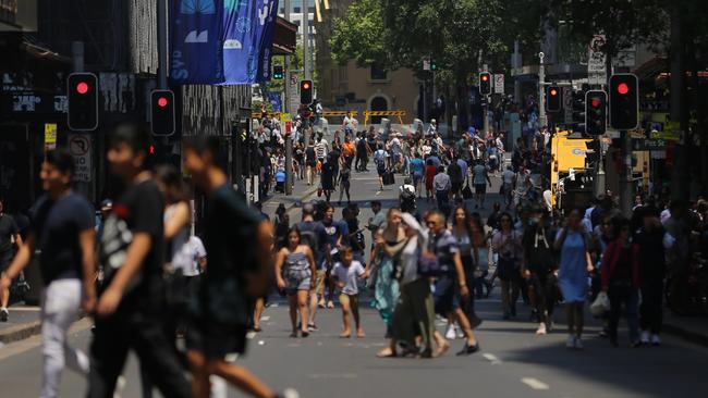 Shoppers walk the CBD on Boxing Day last year.