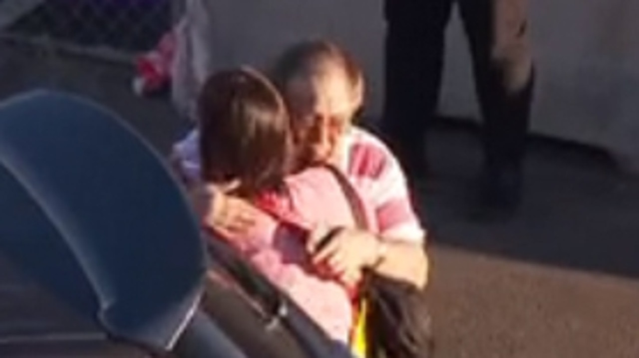 Tanya Sandoe, one of the victims, hugs her father David Sandoe after arriving at Sydney Airport. Picture: Sky News