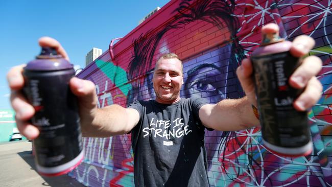 Graffiti artist Drapl has transformed a brick wall off Blackwood St, Michelton, into a colourful showpiece. Photo: AAP/Sarah Marshall)