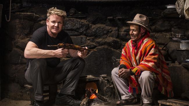 Gordon Ramsay holding a cooked Guinea pig, visits with Mario, a local farmer in Peru. Picture: National Geographic