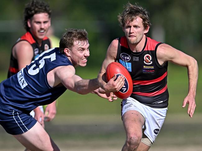 Old Melburnians Charles Lill and Old Xaverians William Hams during the VAFA football match between Old Melburnians and Old Xaverians in Brighton, Saturday, Aug. 20, 2022. Picture: Andy Brownbill