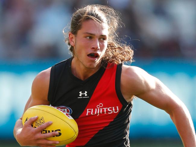 MELBOURNE, AUSTRALIA - MAY 02: Archie Perkins of the Bombers in action during the 2021 AFL Round 07 match between the Essendon Bombers and the Carlton Blues at the Melbourne Cricket Ground on May 02, 2021 in Melbourne, Australia. (Photo by Michael Willson/AFL Photos via Getty Images)