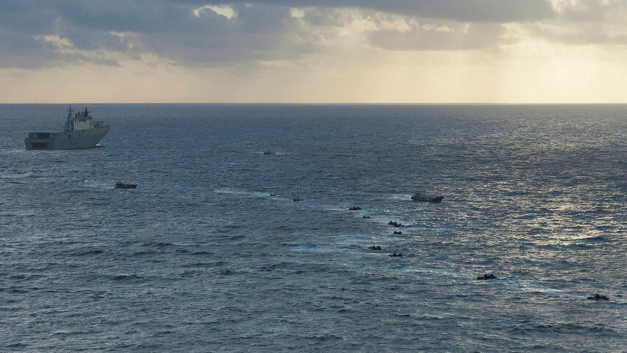 Royal Australian Navy landing craft and United States Marine Corps Amphibious Assault Vehicles move from HMAS Adelaide toward Bellows Beach in Hawaii to conduct the final amphibious assault for Exercise RIMPAC 18. Picture: Defence