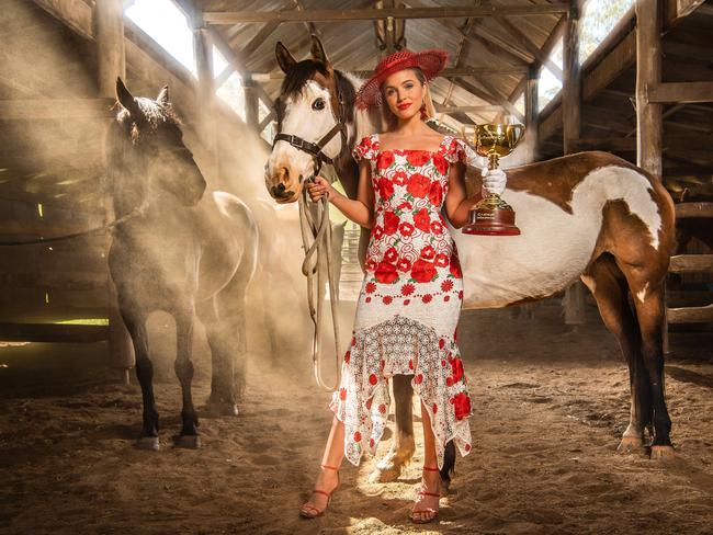 Melbourne Cup Carnival Ambassador Olivia Molly Rogers with the 2018 Lexus Melbourne Cup and Bogong Horseback Adventures station horses in not-so dramatic situation. Picture: Jason Edwards