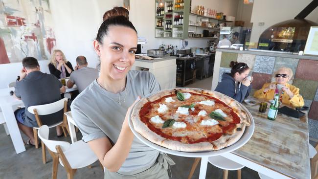 Anna Gazzola with a Goccia’s Rita pizza; tomato base, mozzarella and basil. Photo by Richard Gosling