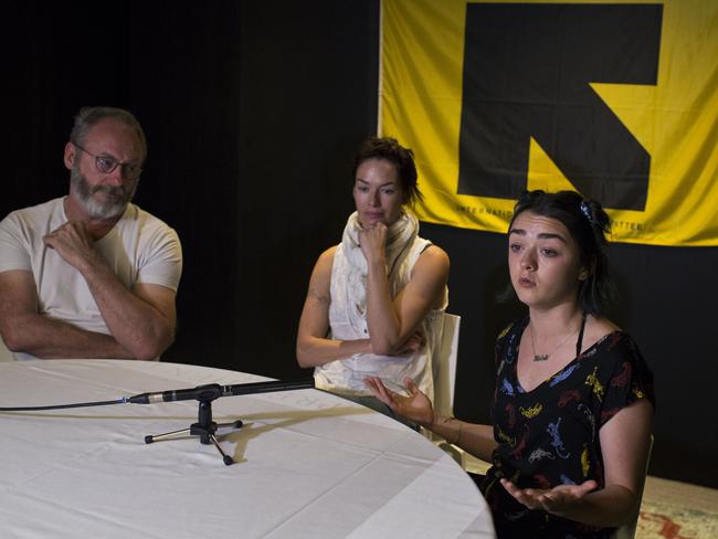 Game of Thrones star Maisie Williams, right, answers a question next to co-stars Liam Cunningham, and Lena Headey. Picture: AP