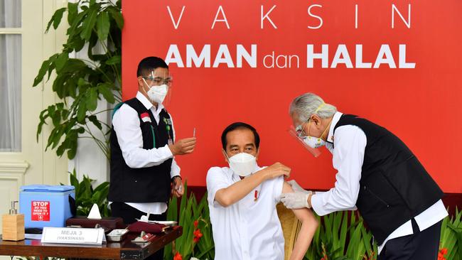 ‘Safe and halal’: Joko Widodo about to be administered Indonesia’s first COVID-19 vaccine at the presidential palace in Jakarta. Picture: AFP