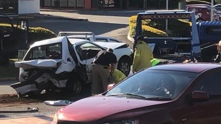 A white hatchback is towed away. Picture: supplied