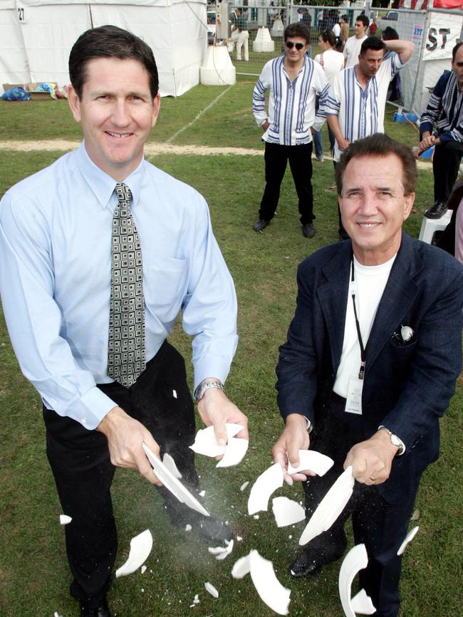 JULY 24, 2005: National Party Leader Lawrence Springborg breaks plates with Jim Raptis. Pic: Ann Louise Hovey