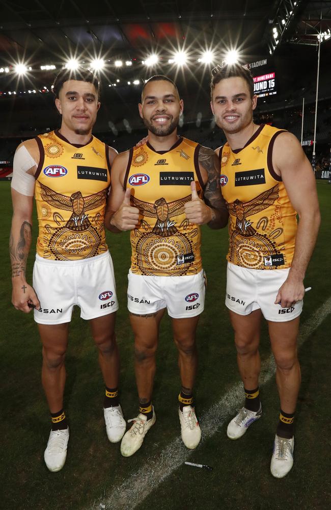 Tyler Brockman, Jarman Impey and Karl Amon in Hawthorn’s 2023 Indigenous jumper. Picture: Getty Images