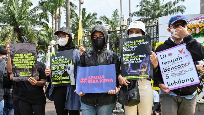 Indonesian activists hold a protest against the new criminal code outside the parliament building in Jakarta. Picture: AFP