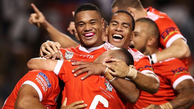 SYDNEY, AUSTRALIA — MAY 06: Leilani Latu of Tonga celebrates with team mates after scoring the match winning try during the 2017 Pacific Test Invitational match between Tonga and Fiji at Campbelltown Sports Stadium on May 6, 2017 in Sydney, Australia. (Photo by Brendon Thorne/Getty Images)