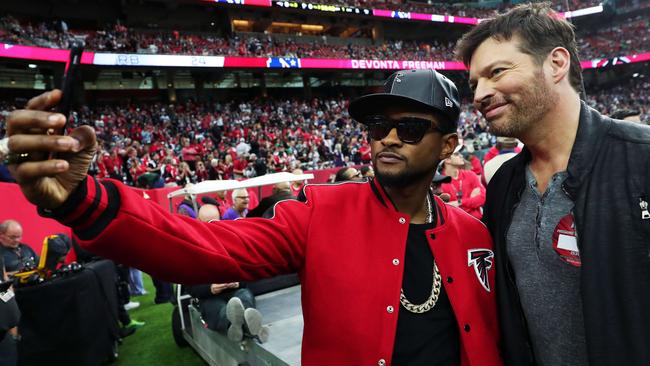 Usher and Harry Connick Jr. pose for a photo in Houston. Picture: Getty