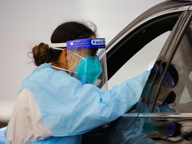 SYDNEY, AUSTRALIA - NewsWire Photos MAY 15, 2021:  A nurse is seen performing a Coriona Virus test at the Bondi Beach Covid Testing Clinic which  appears to be relatively empty today as lower than normal numbers of people come to get tested, in Sydney, Australia. Picture: NCA NewsWire / Gaye Gerard