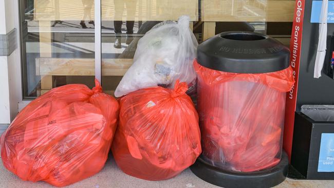 ADELAIDE, AUSTRALIA - NewsWire Photos NOVEMBER 9, 2022: Plastic bags below a notice in Coles at Park Holme in AdelaideÃs south saying soft plastic bags will no longer be recycled . Picture: NCA NewsWire / Brenton Edwards