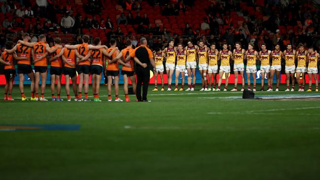 Players line up for the Australian National Anthem. Photo by Cameron Spencer/Getty Images.