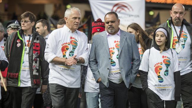 Michael Long with Prime Minister Malcolm Turnbull on The Long Walk. Picture: Jason Edwards