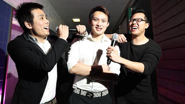 Karaoke-loving friends, from left, Baiwen Su, Yizhou Wang and Yinghuan Liu are hoping to open a karaoke bar in Soundys Lane, between the Elizabeth St Mall and Wellington Court. Picture: LUKE BOWDEN