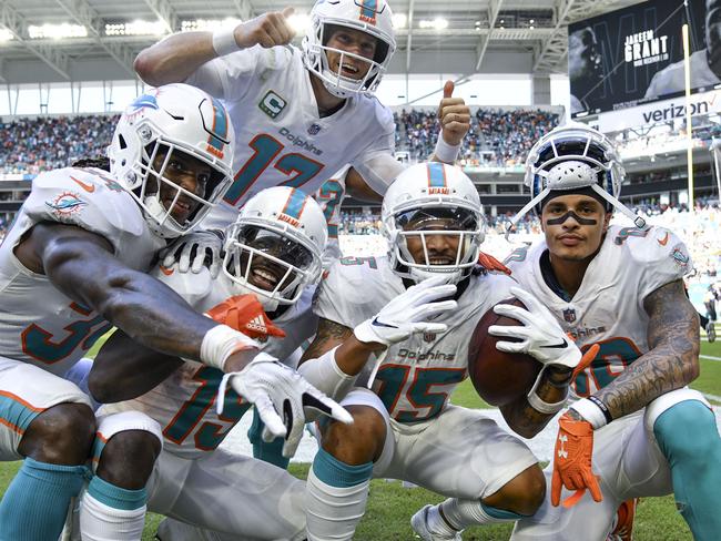 MIAMI, FL - SEPTEMBER 23: The Miami Dolphins celebrate after scoring a touchdown during the fourth quarter against the Oakland Raiders at Hard Rock Stadium on September 23, 2018 in Miami, Florida.   Mark Brown/Getty Images/AFP == FOR NEWSPAPERS, INTERNET, TELCOS & TELEVISION USE ONLY ==