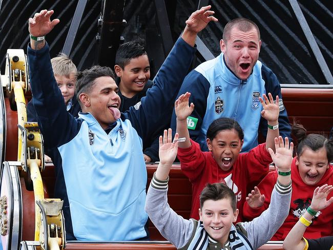 Latrell Mitchell and David Klemmer ride the pirate ship at Luna Park, Melbourne. Picture: Brett Costello