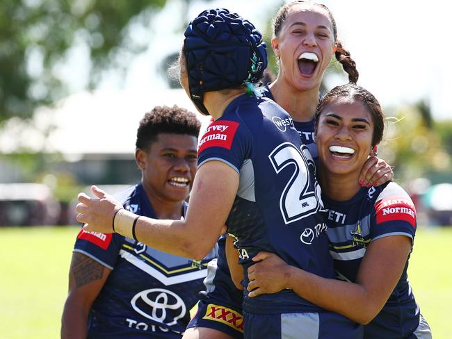 Cowboys players celebrate with their team mate Tahlulah Tillett after she scores a try in the NRLW pre season match between the North Queensland Cowboys women and the Gold Coast Titans women's team, held at Alley Park, Gordonvale. Picture: Brendan Radke