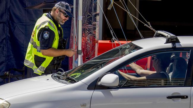 The Queensland Premier has announced changes to the border restrictions and says that no more police will be needed to patrol the state's borders with New South Wales. Police at the Griffith St, Coolangatta, border site Picture: Jerad Williams