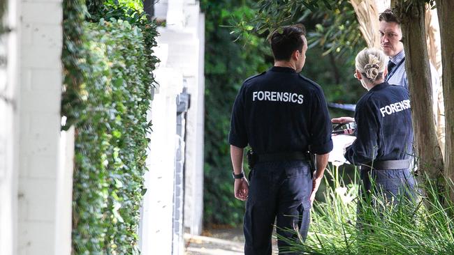 Police forensics were at the scene on Magney street in Woolhara on Wednesday after car was set alight and Israel graffiti was sprayed on garage walls. Picture: NewsWire / Gaye Gerard