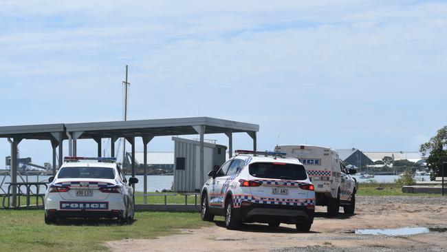 Police investigate the scene on the banks of the Burnett River and interview boaties following a serious boat crash.