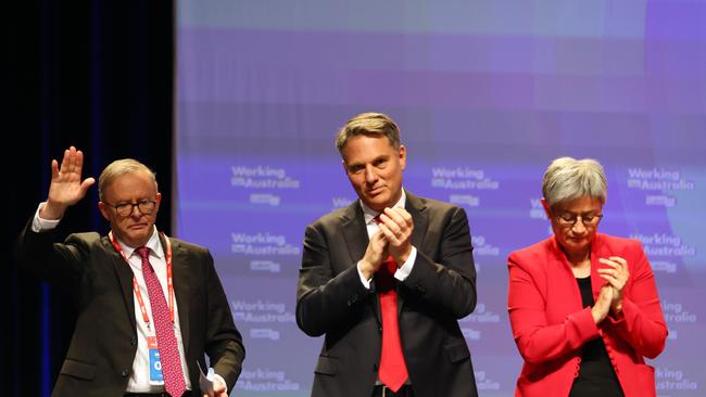 Prime Minister Anthony Albanese, left, Deputy Prime Minister Richard Marles and Minister for Foreign Affairs Penny Wong react after AUKUS was passed during the ALP National Conference in Brisbane. Picture: NCA NewsWire/Tertius Pickard