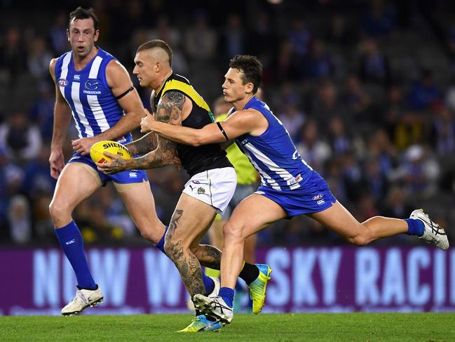 MELBOURNE, AUSTRALIA - MAY 13:  Dustin Martin of the Tigers is tackled by Ben Jacobs of the Kangaroos during the round eight AFL match between the North Melbourne Kangaroos and the Richmond Tigers at Etihad Stadium on May 13, 2018 in Melbourne, Australia.  (Photo by Quinn Rooney/Getty Images)