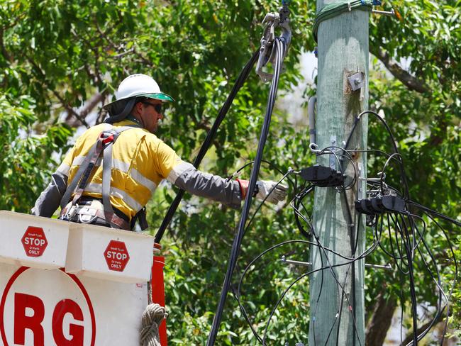 Energex workers restoring power lines at Tamborine on Sunday where over 1000 workers have been deployed from all over the state to help restore power to the region devastated by the Christmas Day storms. Picture Lachie Millard