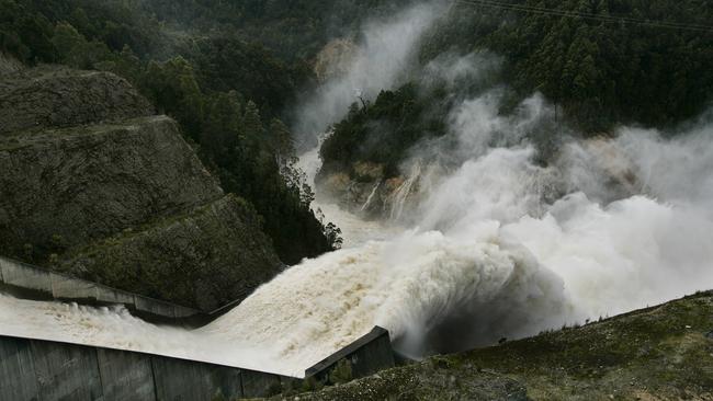 Water flows down the Reece Dam spillway on the state’s West Coast.