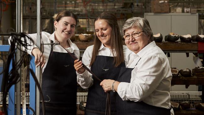 Chloe Fabian and Sam Cook learning from Marija Bisak, 73, who has worked at R.M. Williams for 34 years. Picture: Matt Loxton