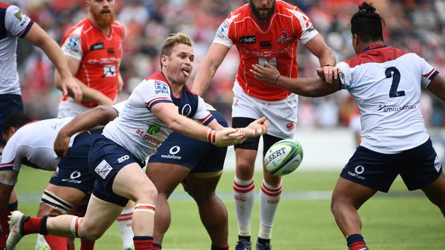 Reds' scrum half Ben Lucas takes the ball out of a scrum in the match against the Sunwolves.