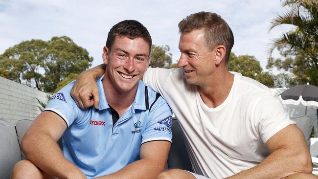 Pictured at home in Caringbah former Sharks legend Adam Dykes with his son, Kade. Picture: Tim Hunter.