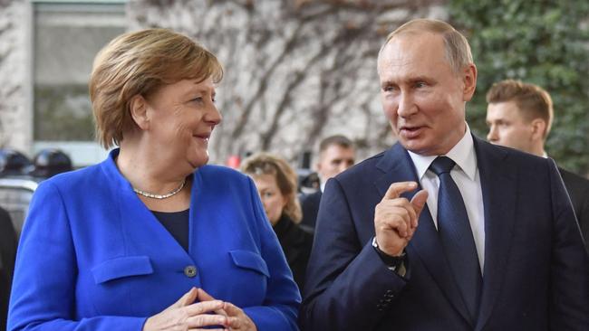 Former German Chancellor Angela Merkel with Russian President Vladimir Putin. Picture: AFP